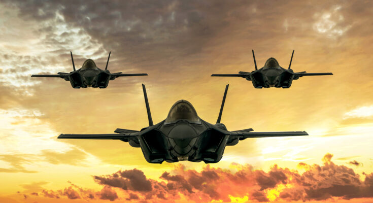 3 F35's flying at dusk.