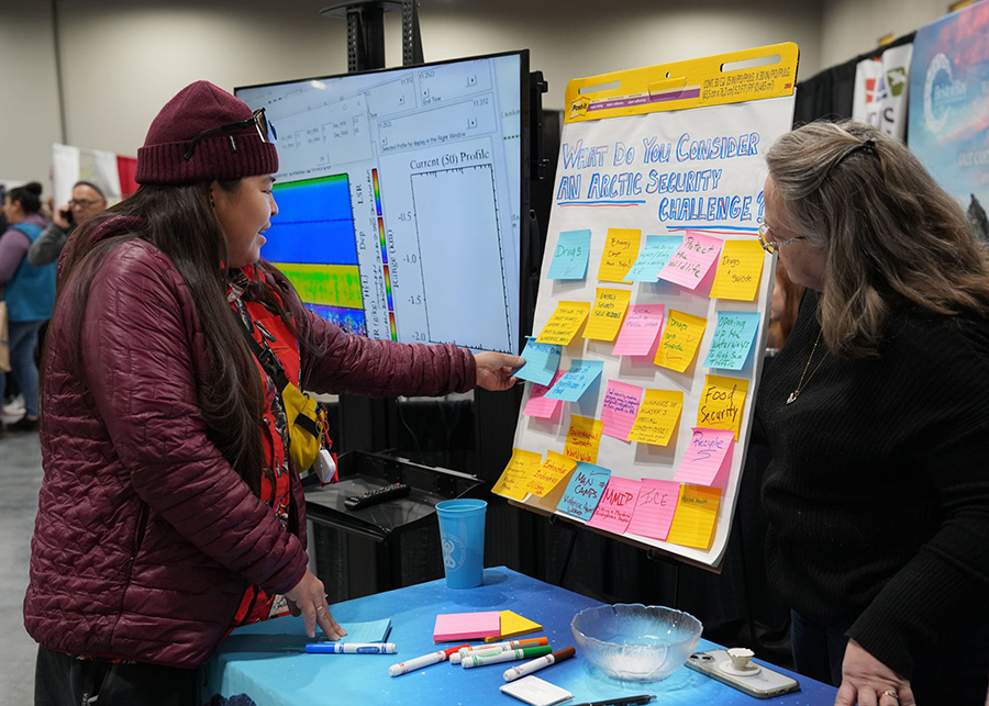 A member of the community shares their perspective on Arctic security during the 2024 Alaska Federation of Natives convention on Oct. 18 at the Dena'ina Civic and Convention Center in Anchorage, Alaska. The Ted Stevens Center for Arctic Security Studies' presence at the convention included an interactive exhibit booth where Alaska Native community members and allies were invited to share their thoughts on Arctic security. A different security question was posed each day, encouraging participation and dialogue. (DOD photo by Amber E. Kurka)