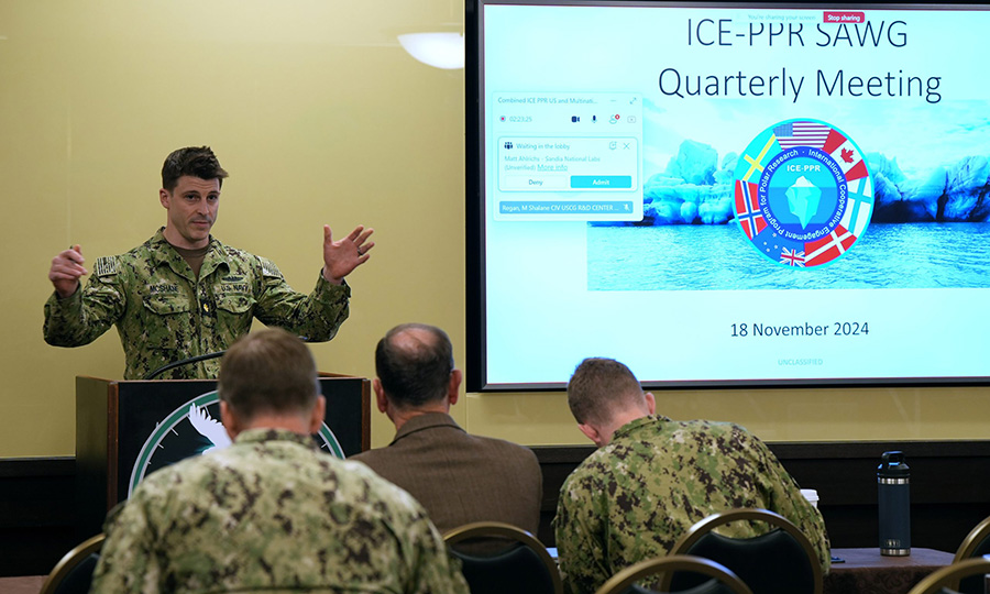 Lt. Cmdr. Barry McShane speaks to participants during the International Cooperative Engagement Program for Polar Research (ICE-PPR) Situational Awareness Working Group (SAWG) quarterly meeting, Nov. 18, 2024, in Anchorage, Alaska. This gathering, which coincided with the Anchorage Security and Defense Conference, brought together Allies and partners across the High North to discuss key advancements in Arctic research, situational awareness, and technology. (U.S. DOD photo by Amber E. Kurka)